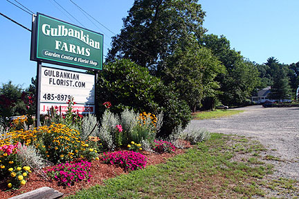 Gulbankian Farms sign and colorful flowerbed