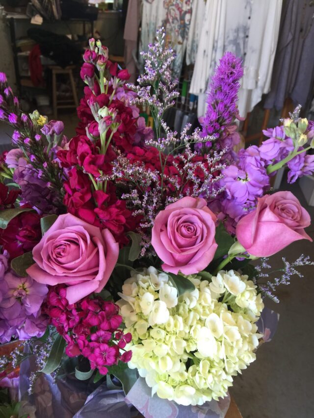 A bouquet of flowers in purple and pink.