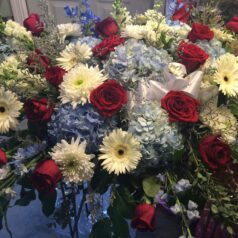 Red white and blue casketpiece flowers