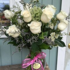 White roses with pink bow
