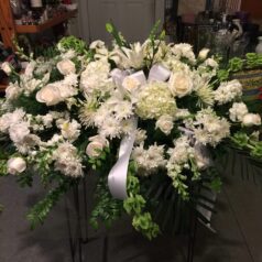 all white casketpiece flowers