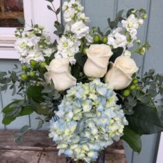 Blue hydrangea white roses white stock flowers