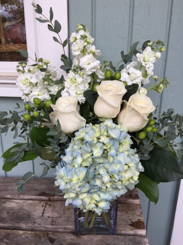 Blue hydrangea white roses white stock flowers