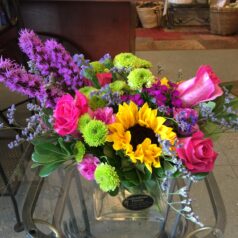 A vase of flowers on top of a table.