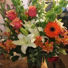 A vase filled with flowers on top of a table.