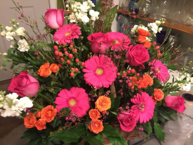 A bouquet of pink and orange flowers in a vase.