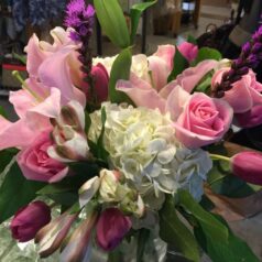 A bouquet of flowers is sitting on the table.