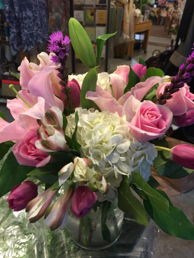 A bouquet of flowers is sitting on the table.