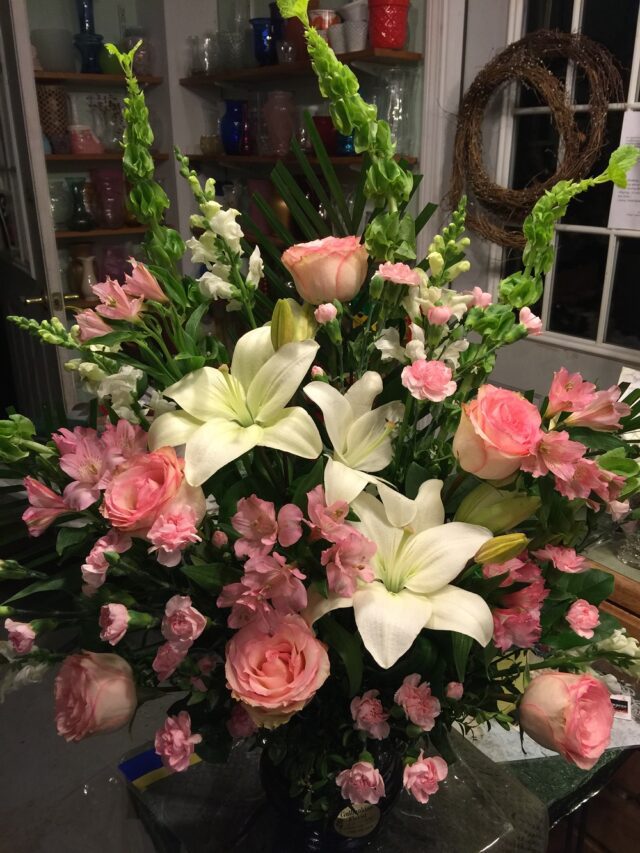 A bouquet of flowers in a vase on the table.