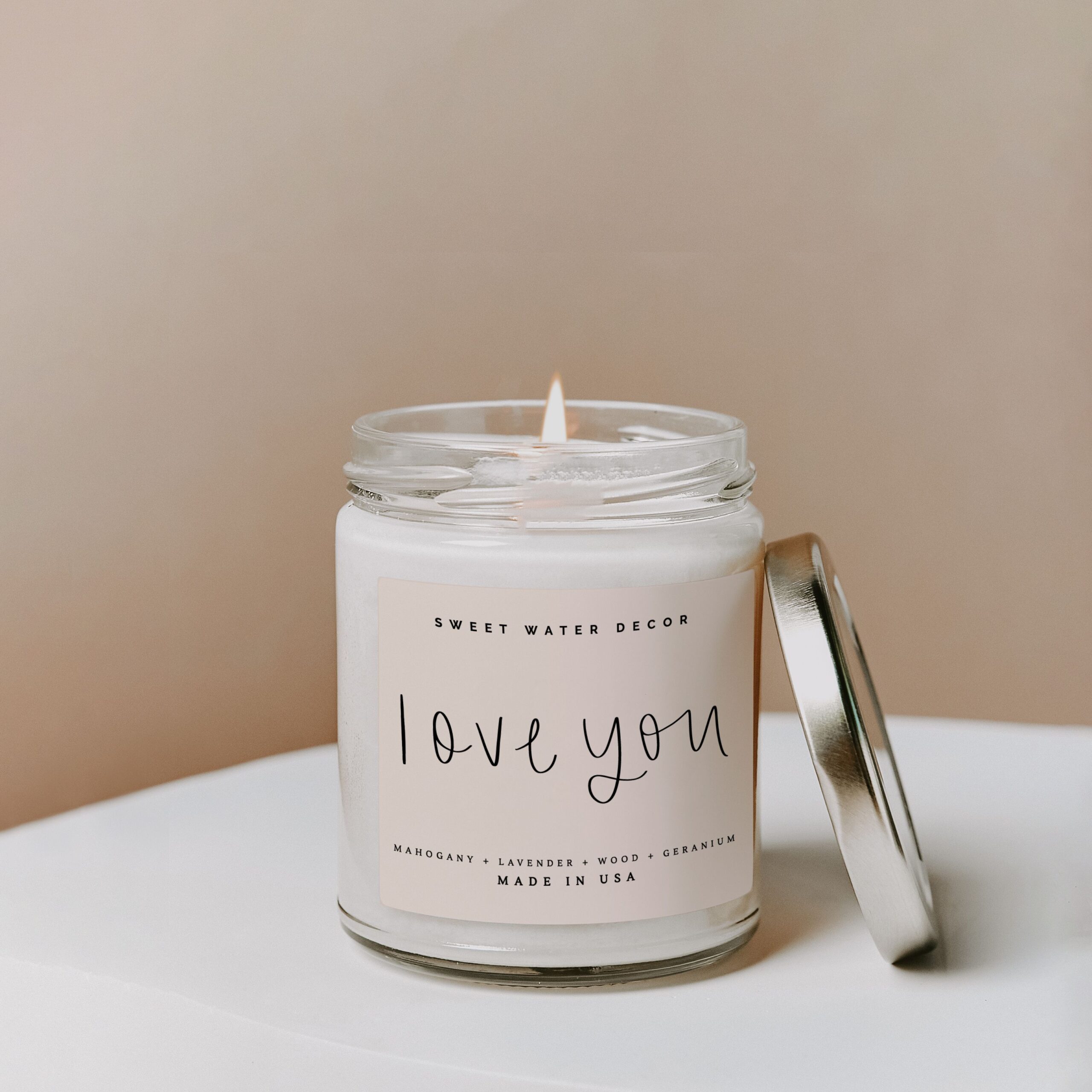 Love you candle on a white flat surface
