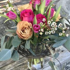 A vase filled with flowers on top of a table.