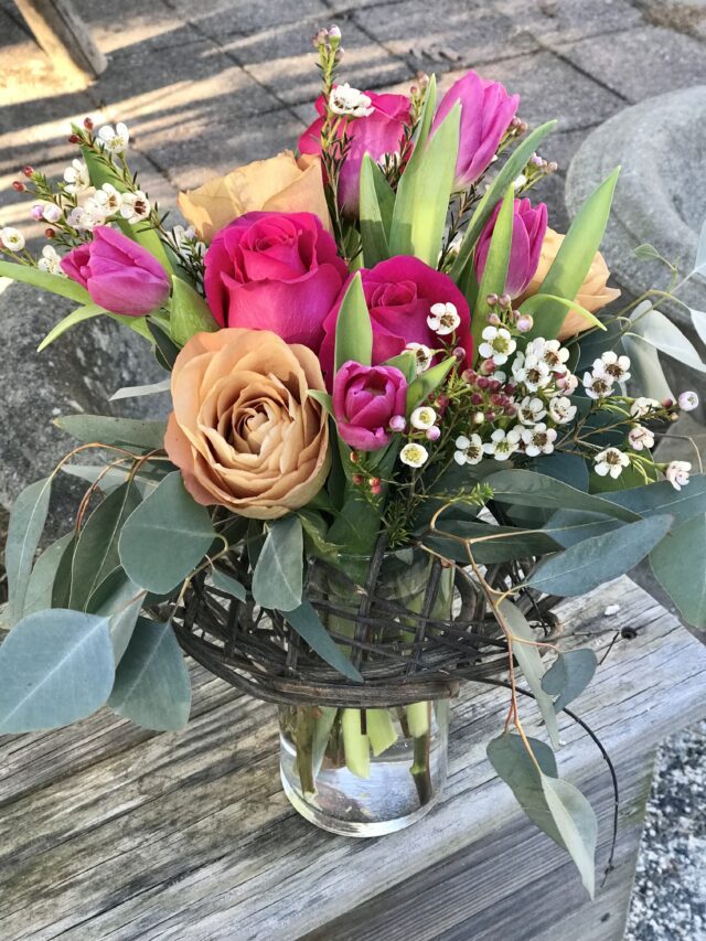 A vase filled with flowers on top of a table.