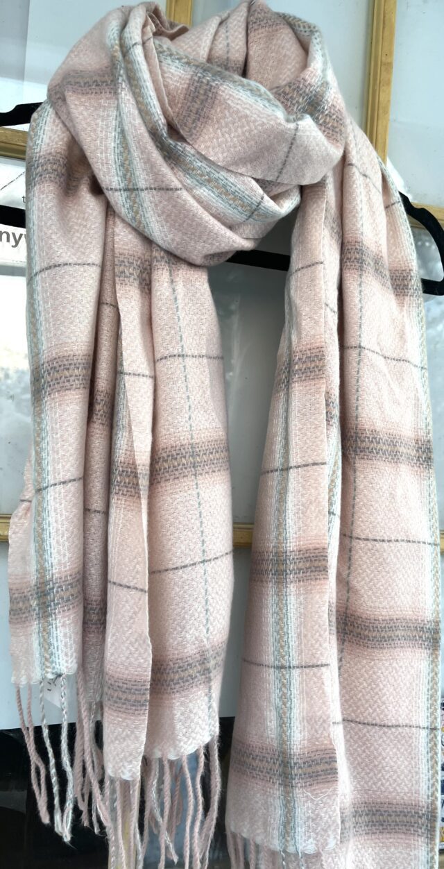 Pink plaid scarf with tassels.