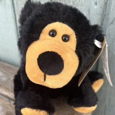 Cute black plush bear cub toy.