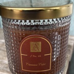 Textured candle jar with cinnamon cider label.