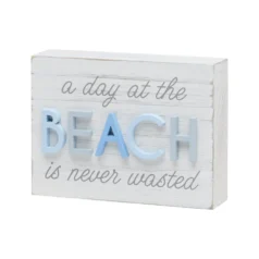 Decorative beach-themed wooden block sign.